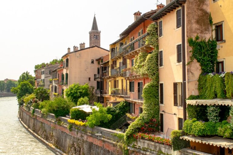 view of houses along the adige river as seen from ponte pietra, one of the best things to do in verona italy